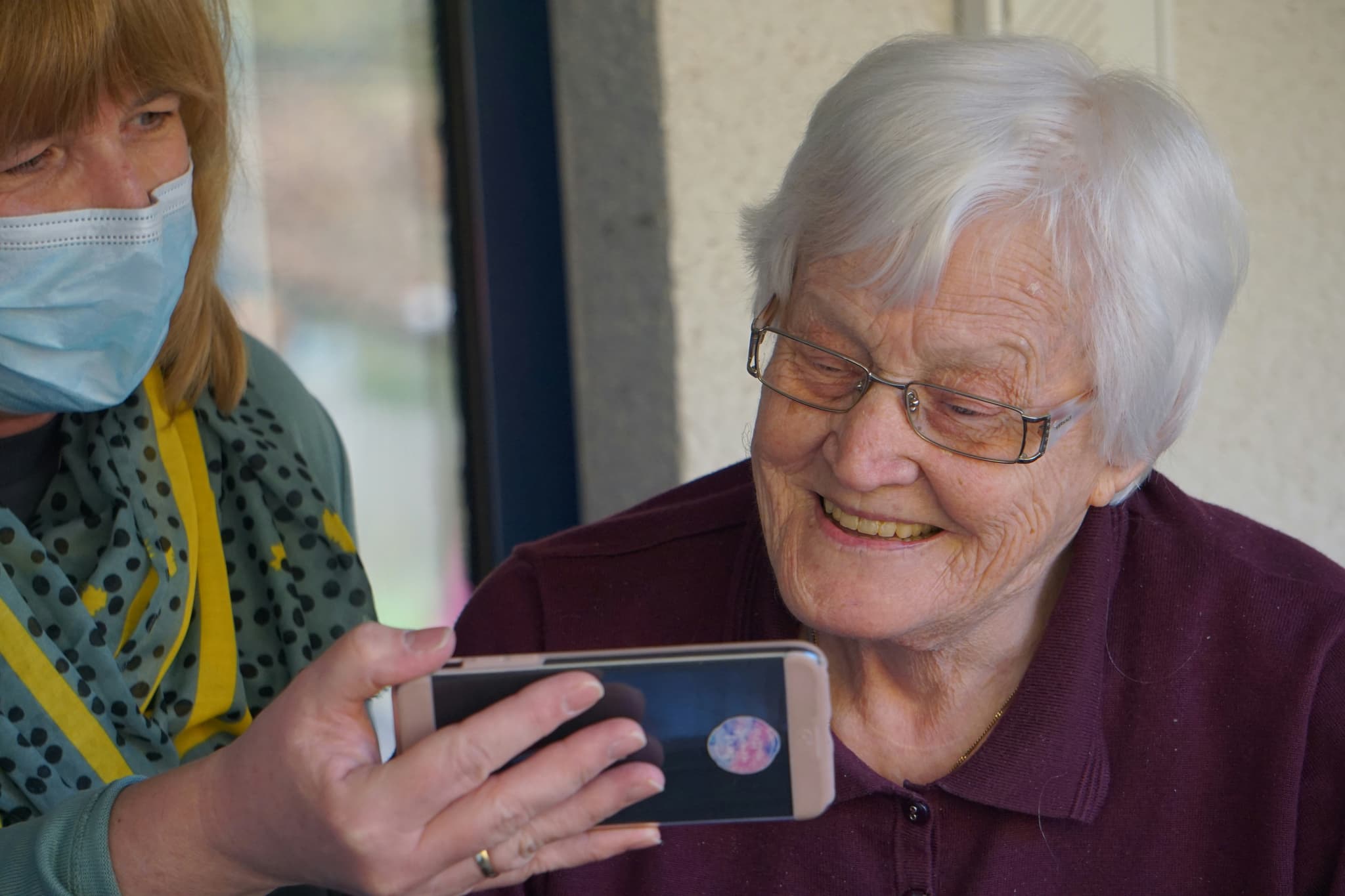 Care Provider Helping Elder